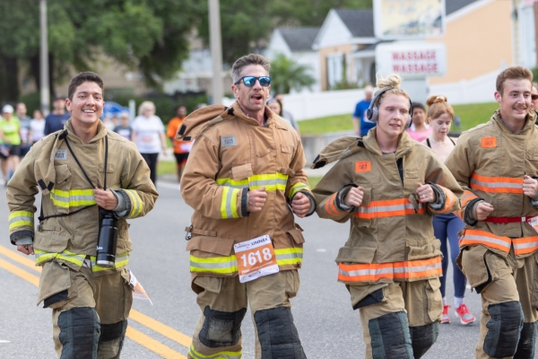 Firefighters running together at AdventHealth Corporate 5K